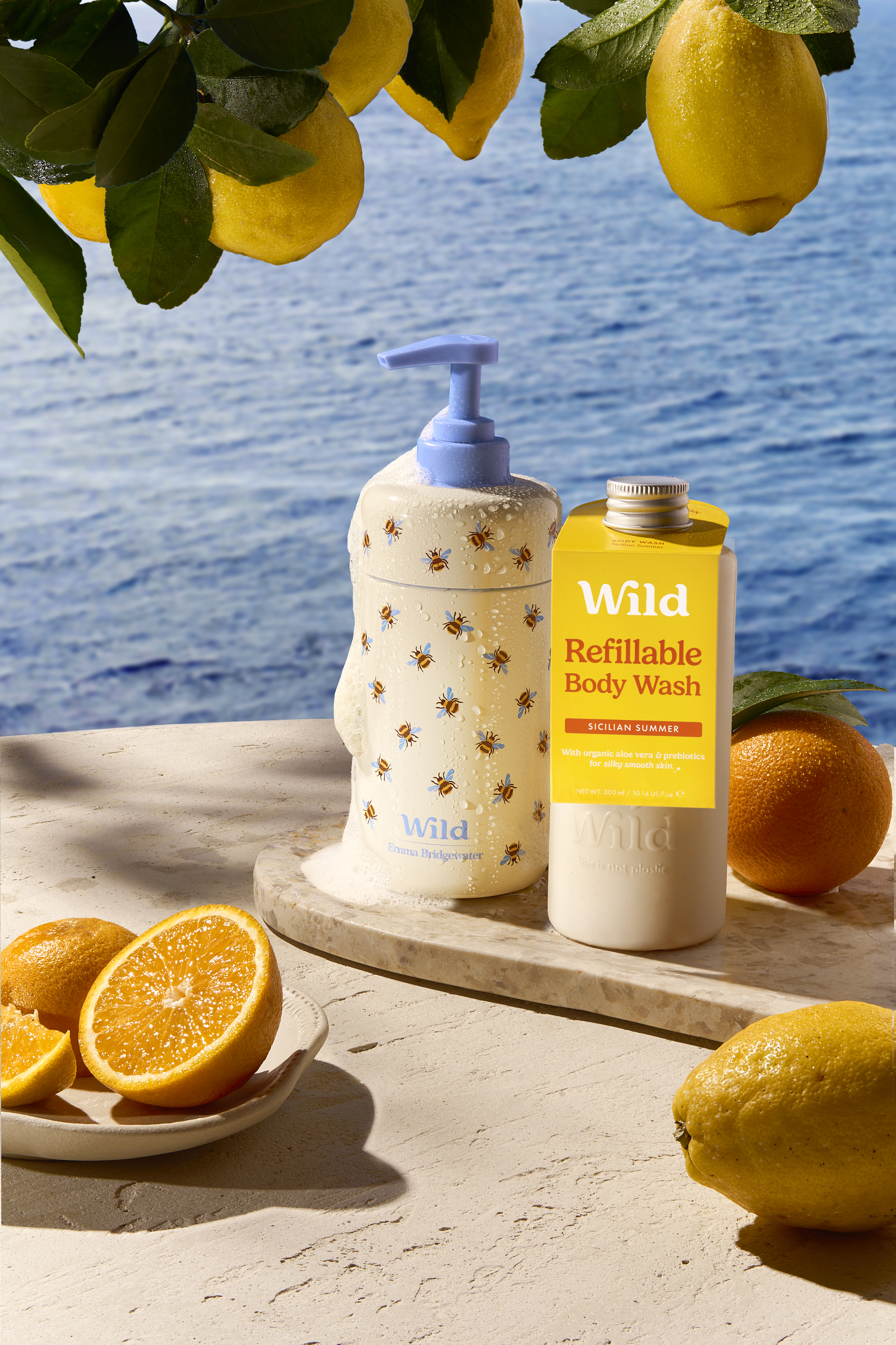 Caption: a bottle of soap next to a plate of lemons