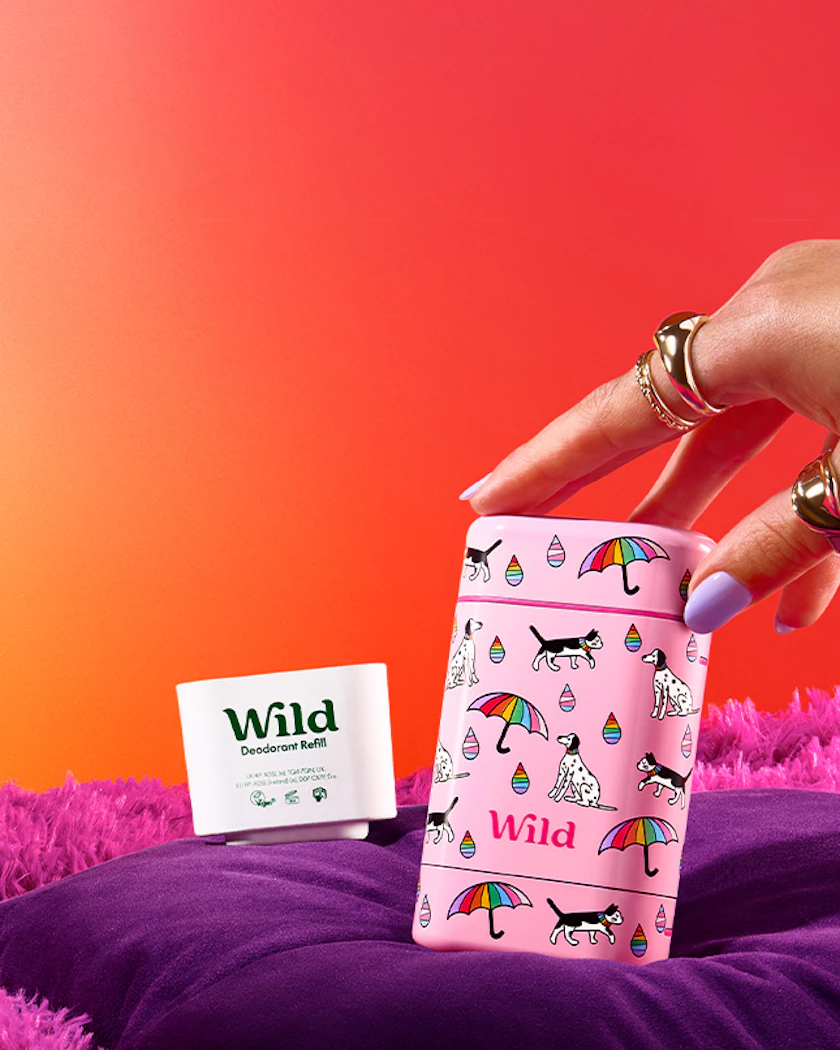 Caption: a woman's hand reaching into a pink gift bag