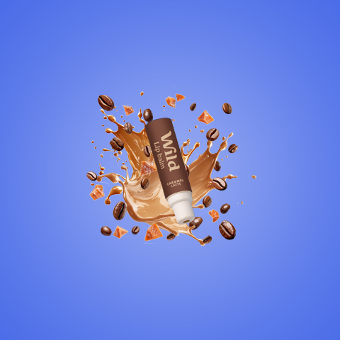 Caption: a tube of chocolate milk with coffee beans falling out of it