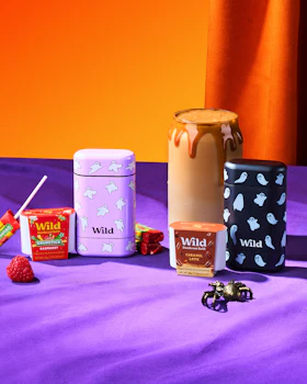 Caption: a table topped with lots of different types of candy