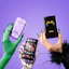 Caption: a person holding a cell phone in their hands