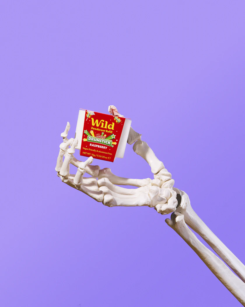 Caption: a fake skeleton holding a box of waffles
