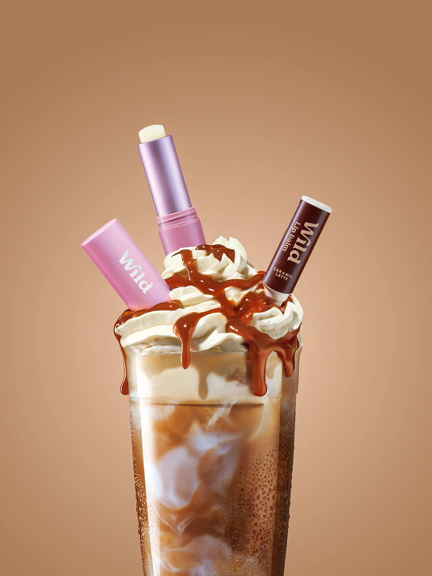 Caption: a chocolate milkshake with whipped cream and chocolate on top