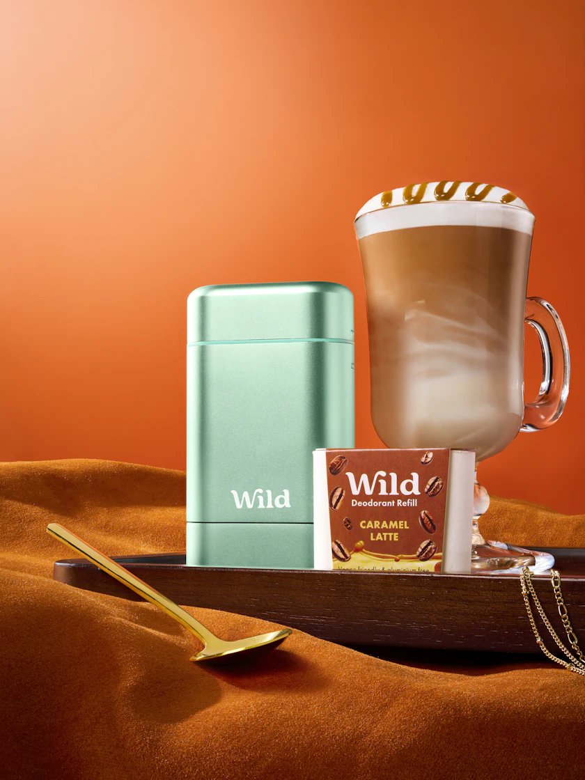 Caption: a tray with a cup of coffee and a bar of chocolate