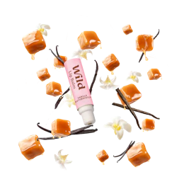 Bildunterschrift: eine Tube Lippenbutter, umgeben von Blumen