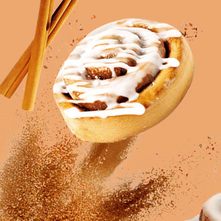 Caption: a cinnamon roll with a cinnamon stick sticking out of it