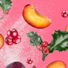Caption: a pink background with various fruits and berries