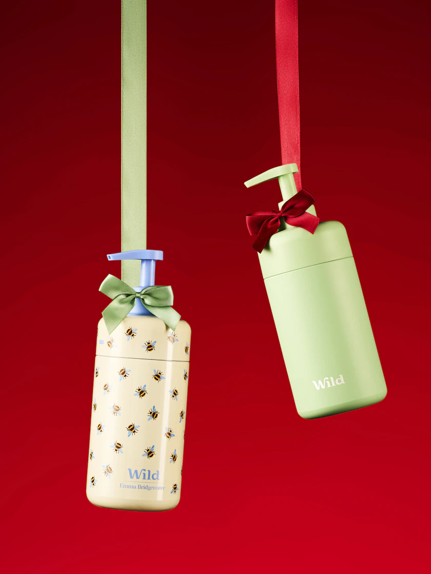 Caption: a couple of tags hanging from a red wall