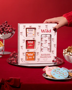 Caption: a person is holding a box of wild products