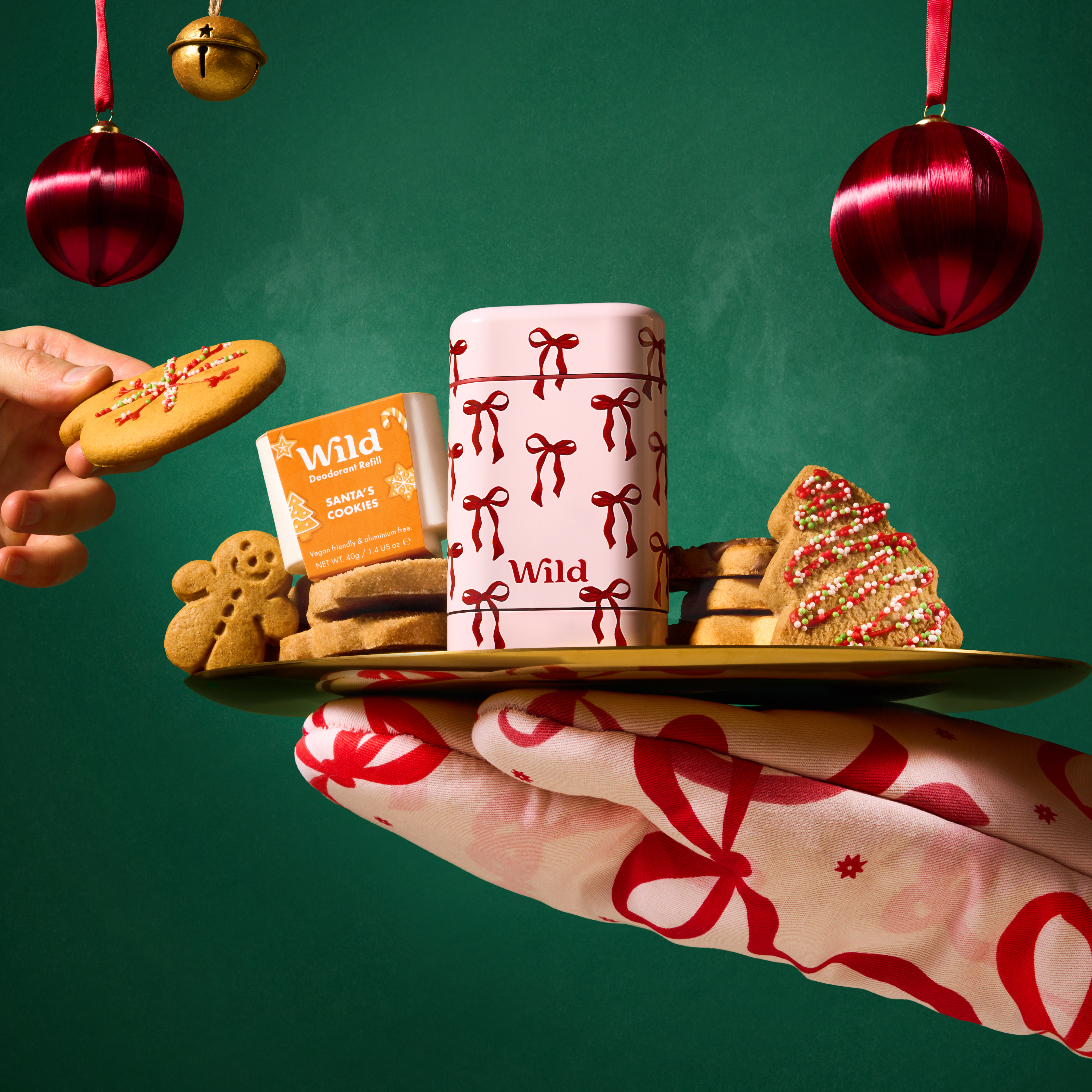 Caption: a person holding a tray of cookies and coffee