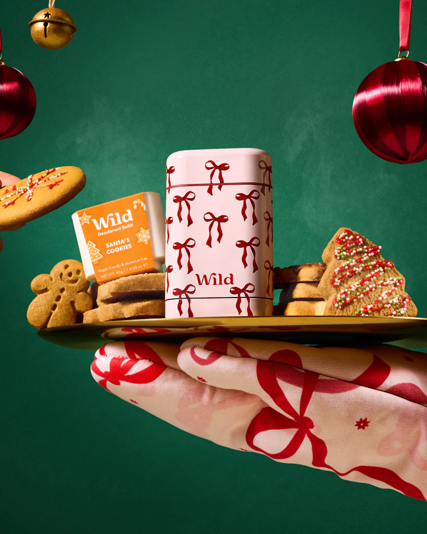 Caption: a person holding a tray of cookies and coffee