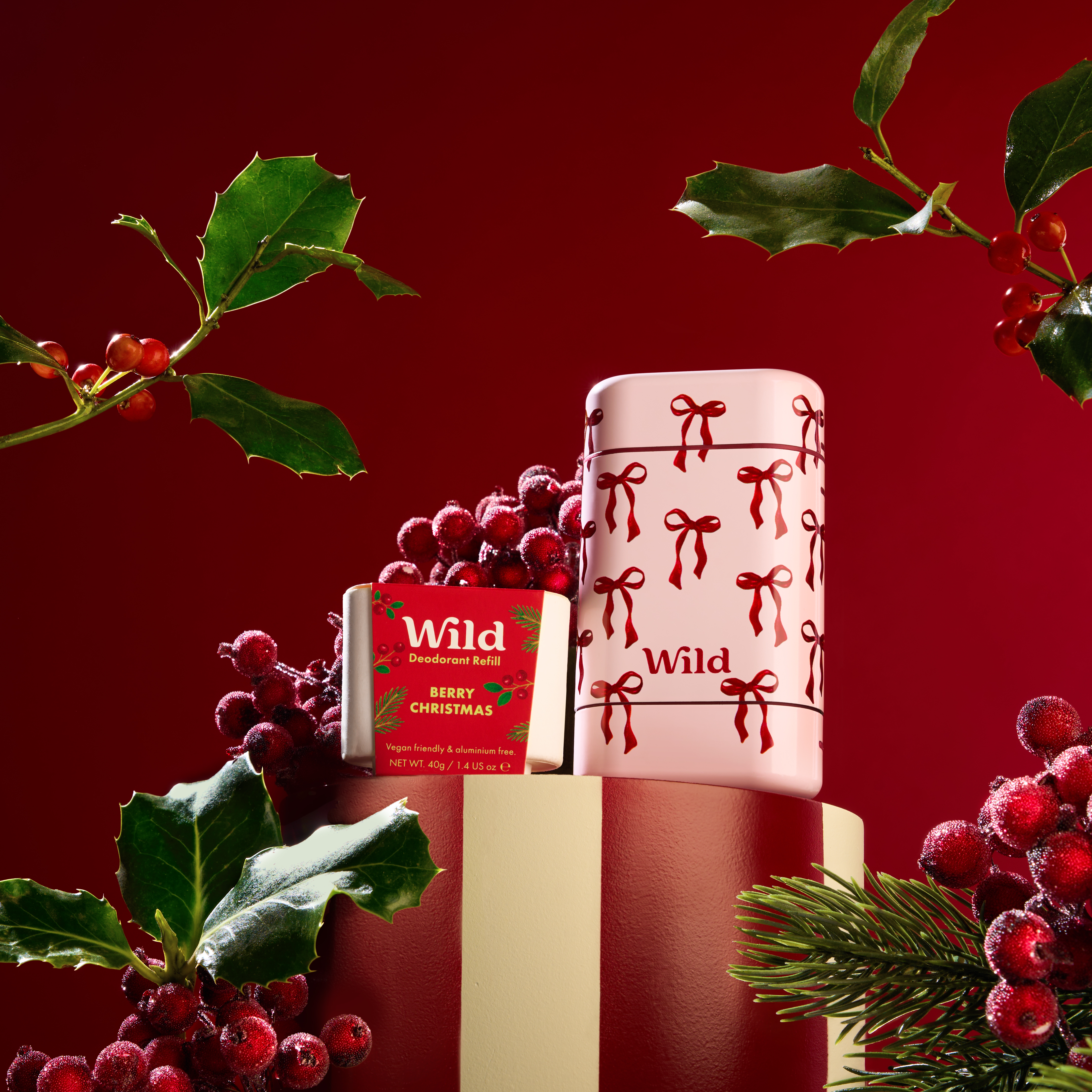 Caption: a red and white christmas cake sitting on top of a table