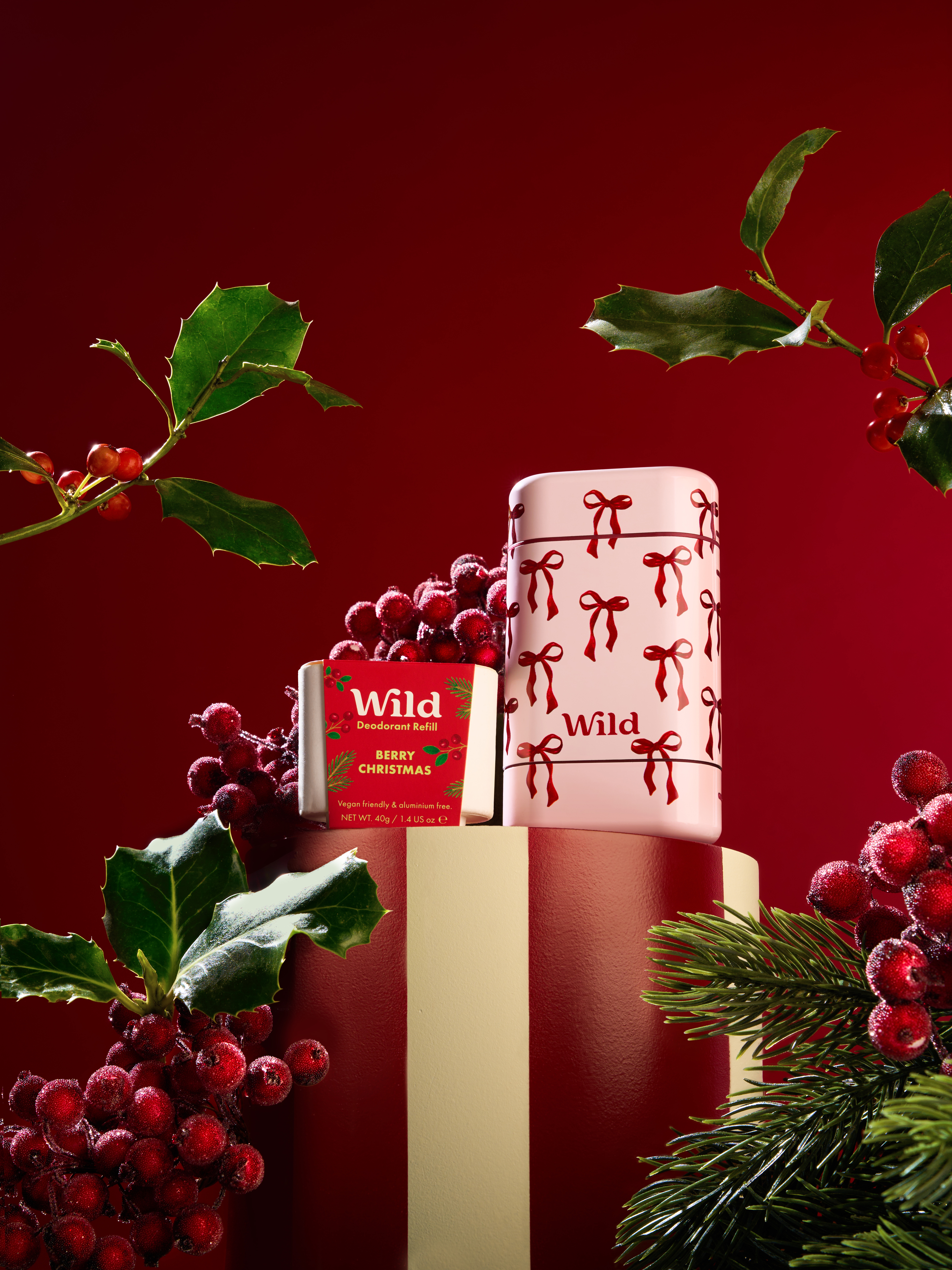 Caption: a red and white christmas cake sitting on top of a table