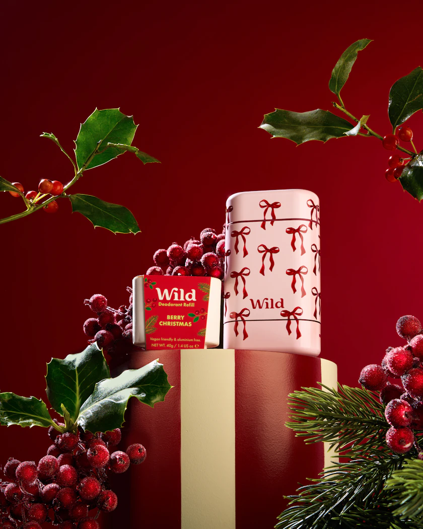 Caption: a red and white christmas cake sitting on top of a table