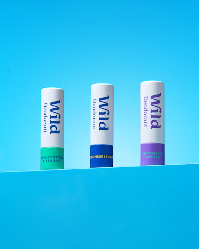 Caption: three pill bottles sitting on top of a blue surface
