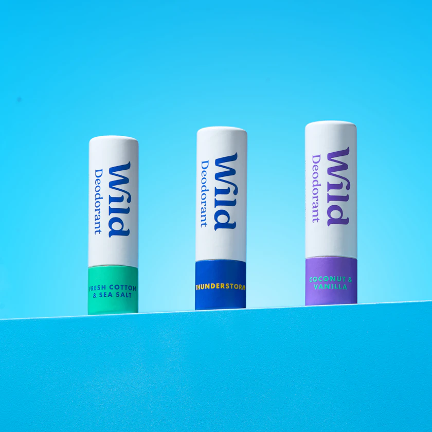 Caption: three pill bottles sitting on top of a blue surface
