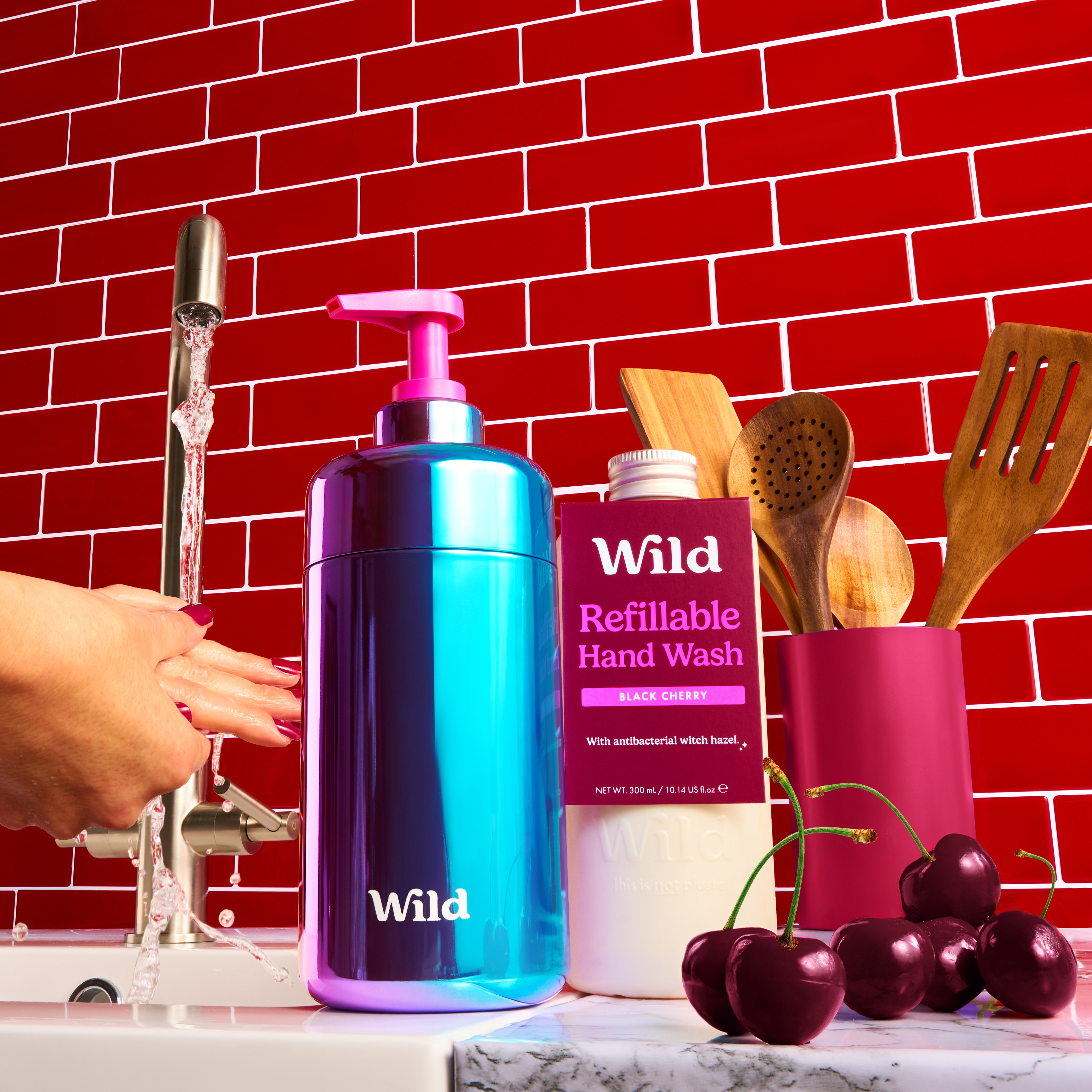 Caption: a woman's hand reaching for a bottle of hand wash