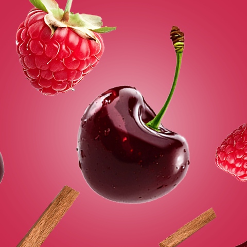 Caption: a raspberry, a cherry, and a chocolate ice cream sundae