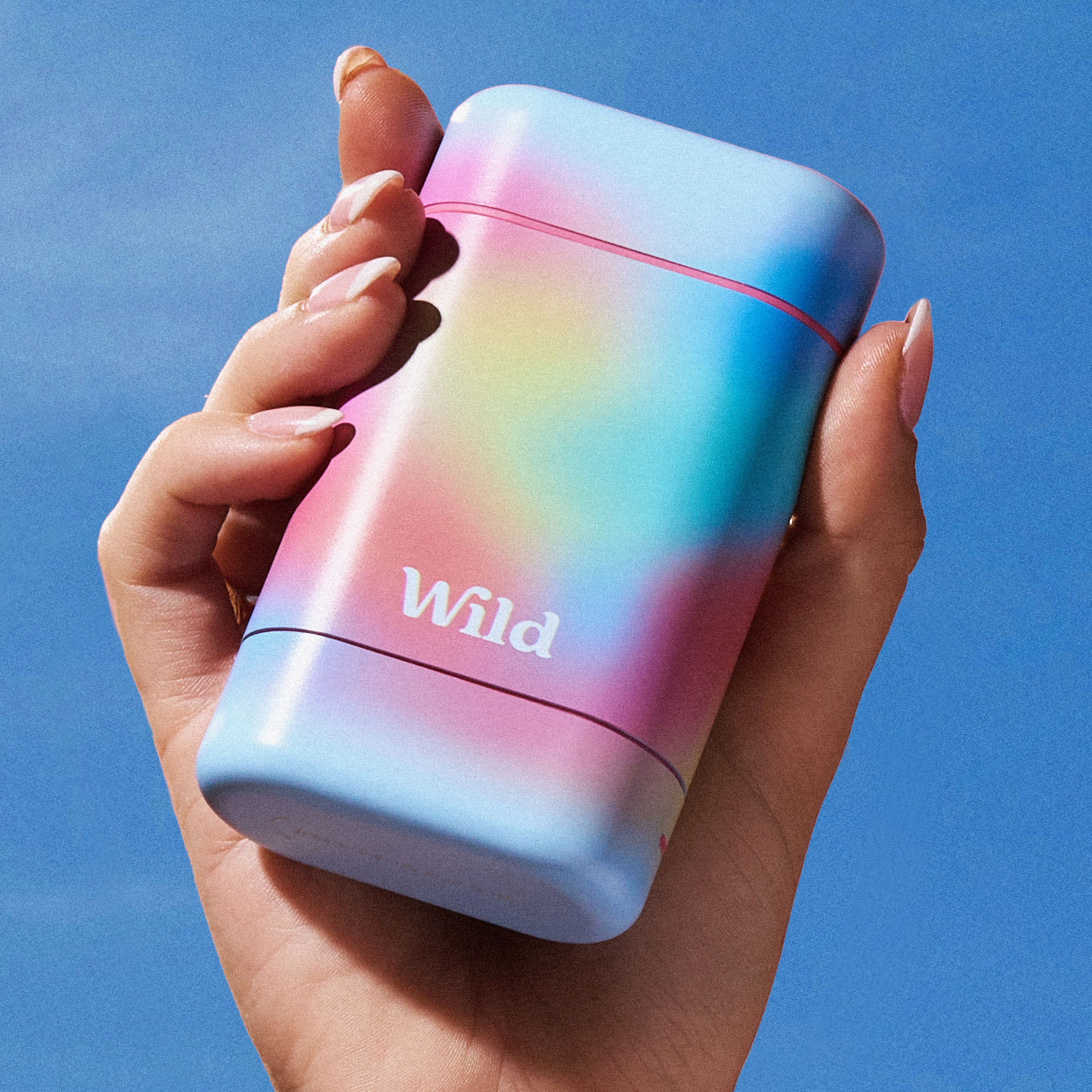 Caption: a person holding a colorful lighter in their hand