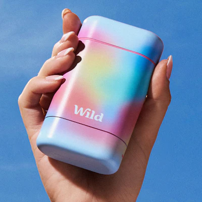 Caption: a person holding a colorful lighter in their hand