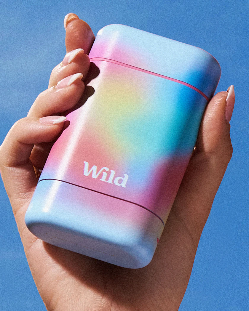 Caption: a person holding a colorful lighter in their hand