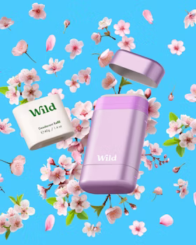 Caption: a couple of pink containers sitting on top of a blue surface