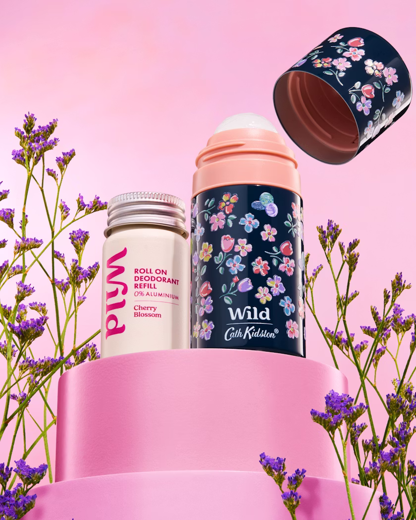 Caption: a couple of bottles that are next to some flowers