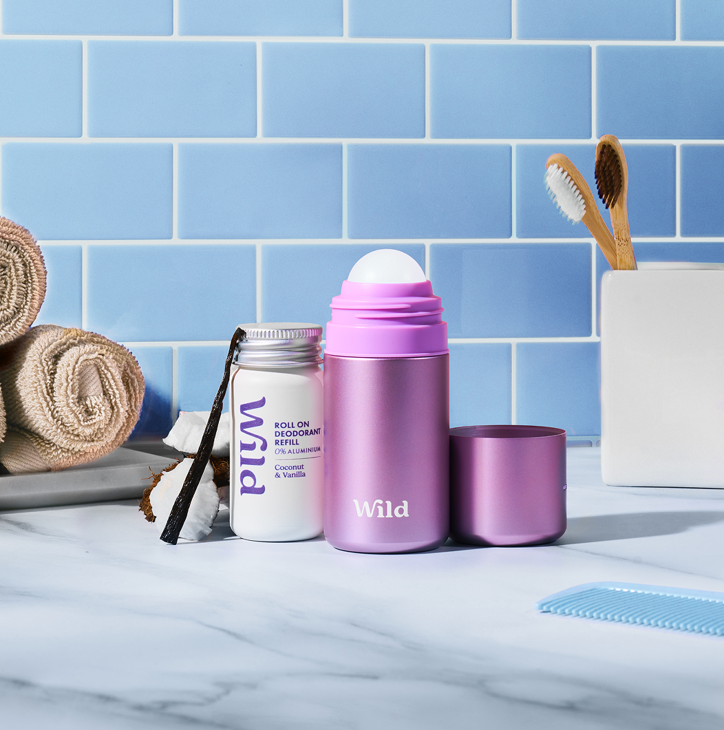 Caption: a bathroom counter with a toothbrush, toothpaste, and other items