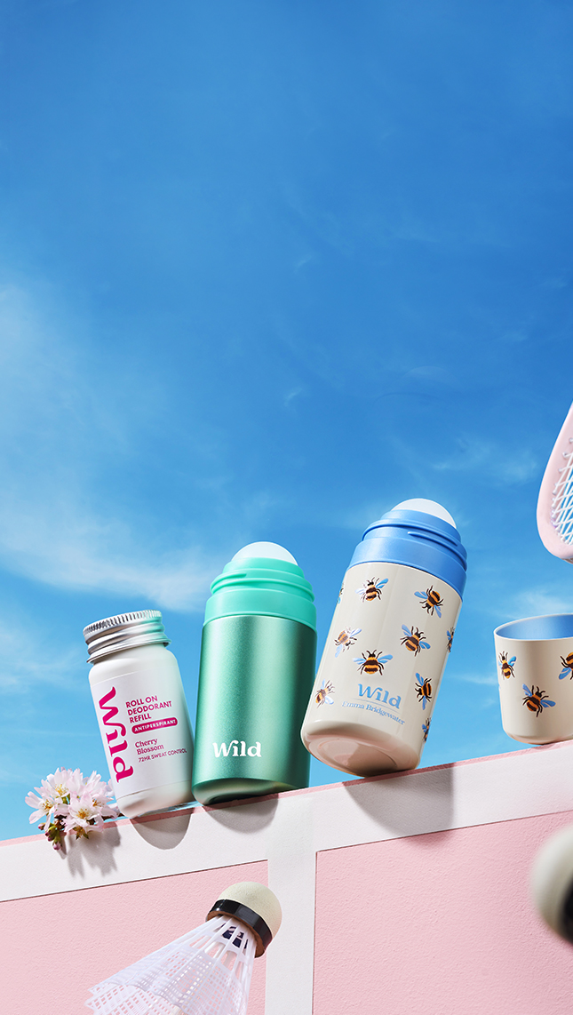 Caption: a pink wall with a bunch of different items on top of it