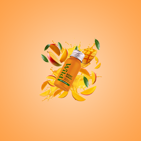 Caption: a bottle of mango juice on a yellow background