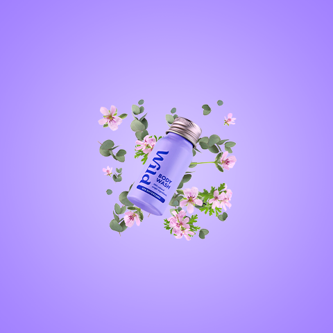 Caption: a bottle of deodorant surrounded by flowers