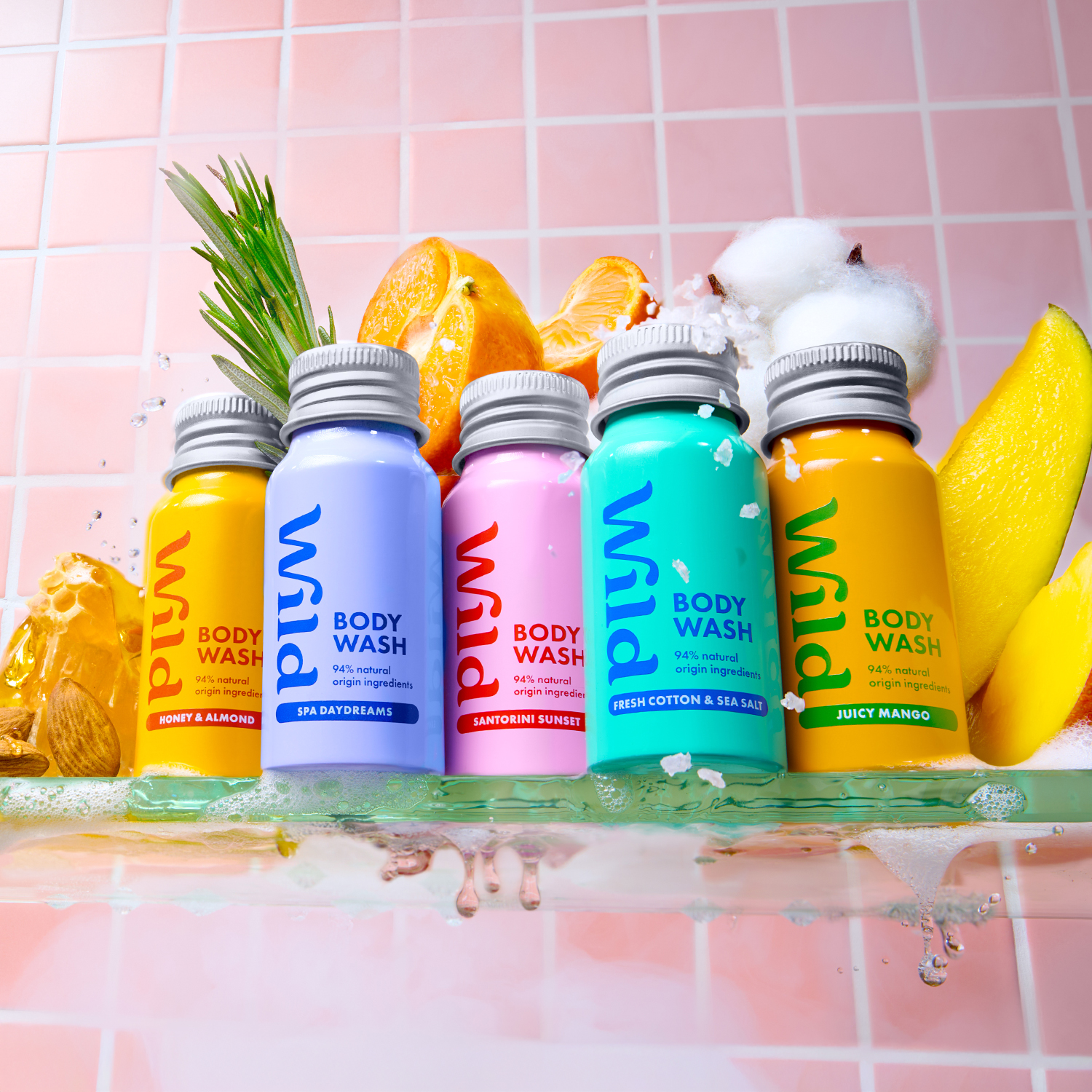 Caption: a row of body wash bottles sitting on top of a counter