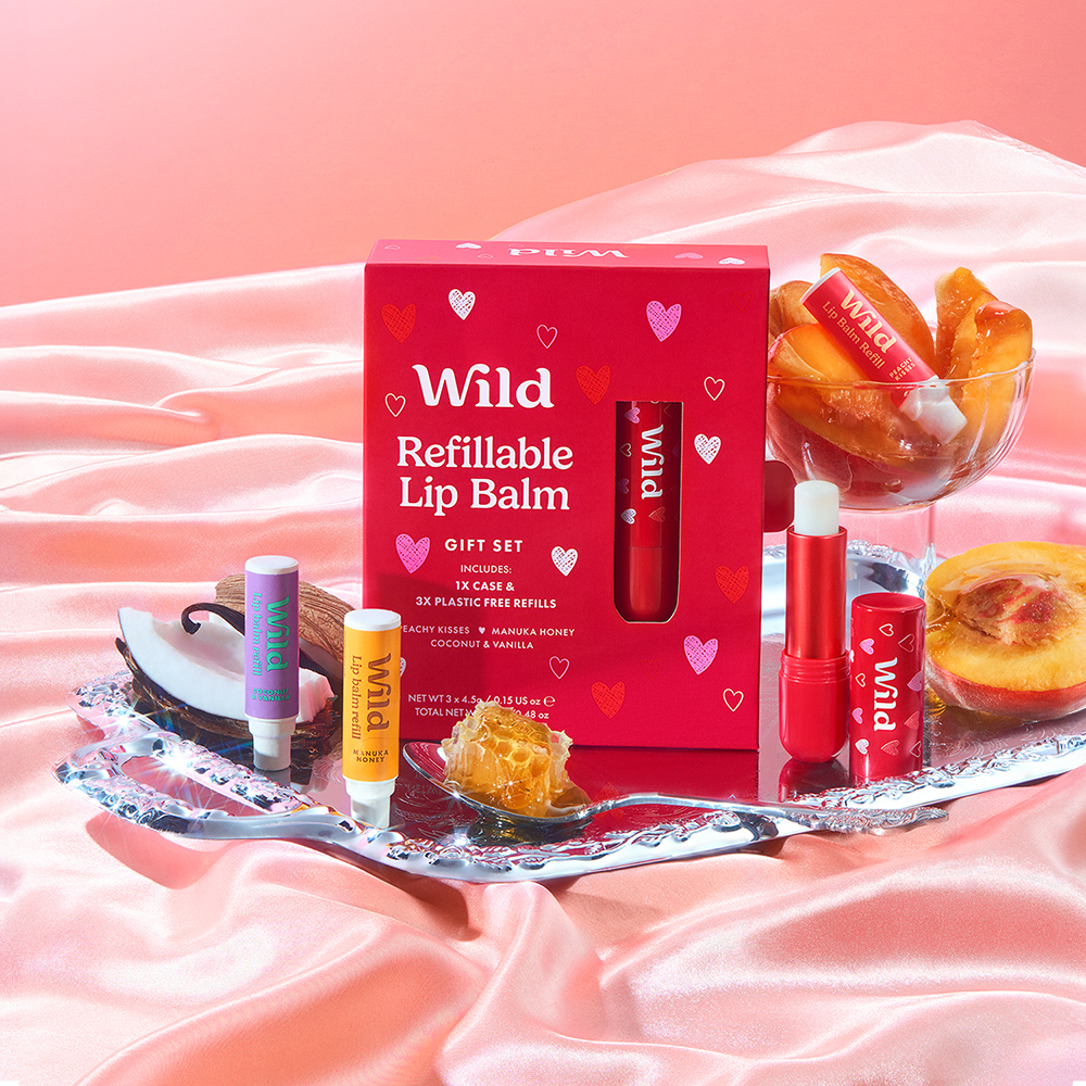 Caption: a box of lip balm sitting on top of a bed