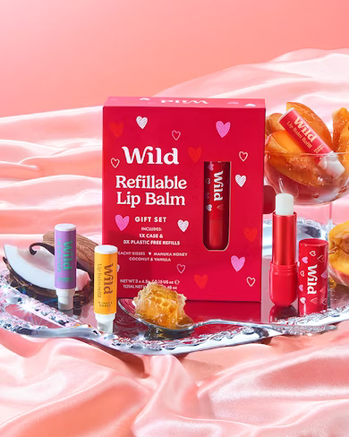 Caption: a box of lip balm sitting on top of a bed