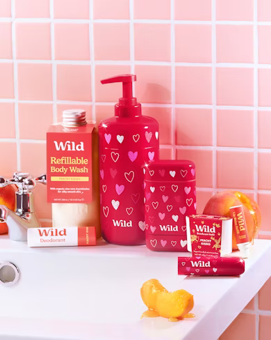 Caption: a bathroom counter with soap, lotion, and soap dispenser