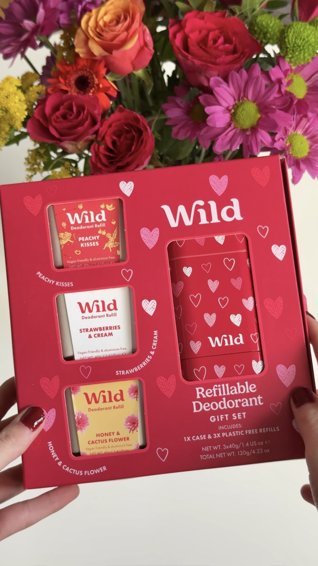 Caption: a person holding a box of wild products