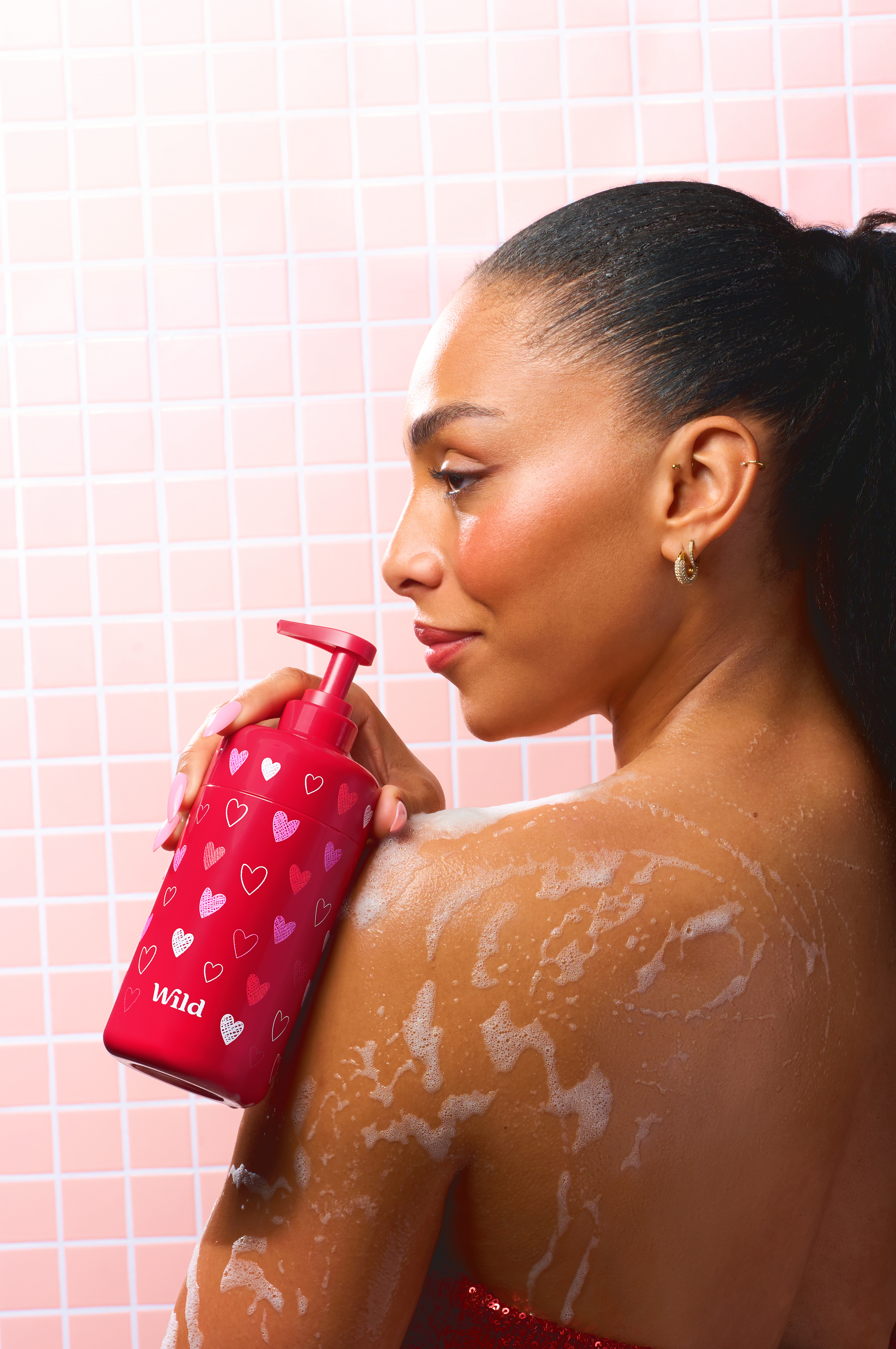 Caption: a woman in a red dress holding a red container