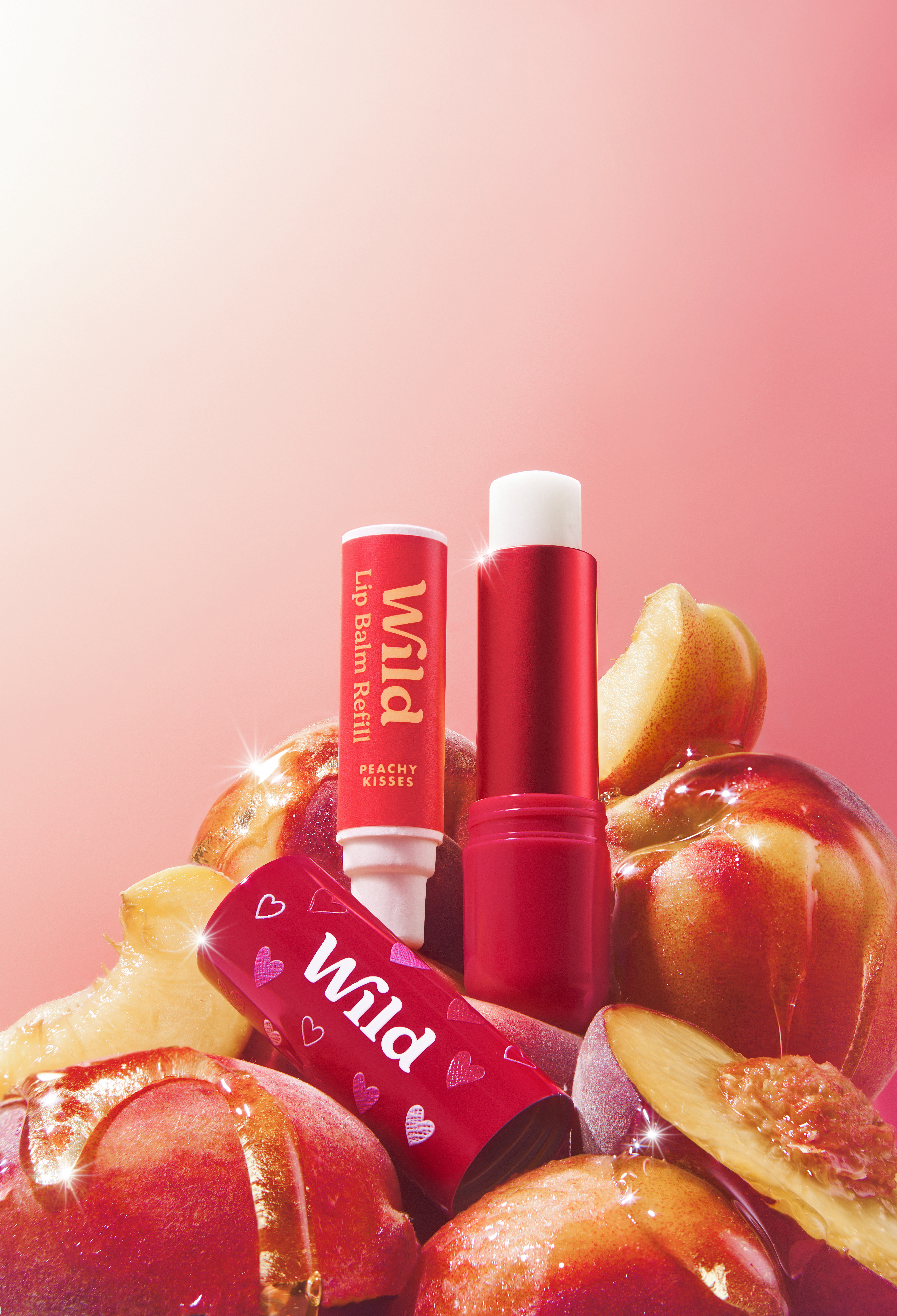 Caption: a pile of apples with lip bales on top of them