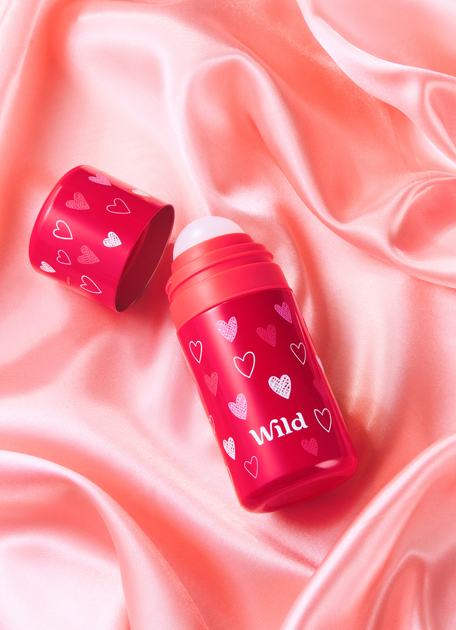 Caption: a couple of red containers sitting on top of a white cloth