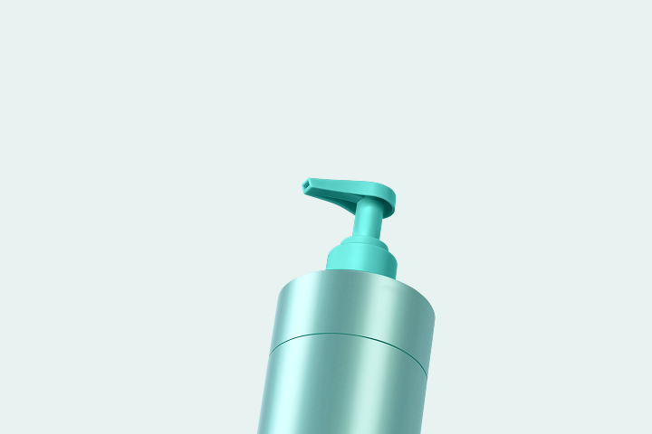 Caption: a bottle of lotion sitting on top of a table