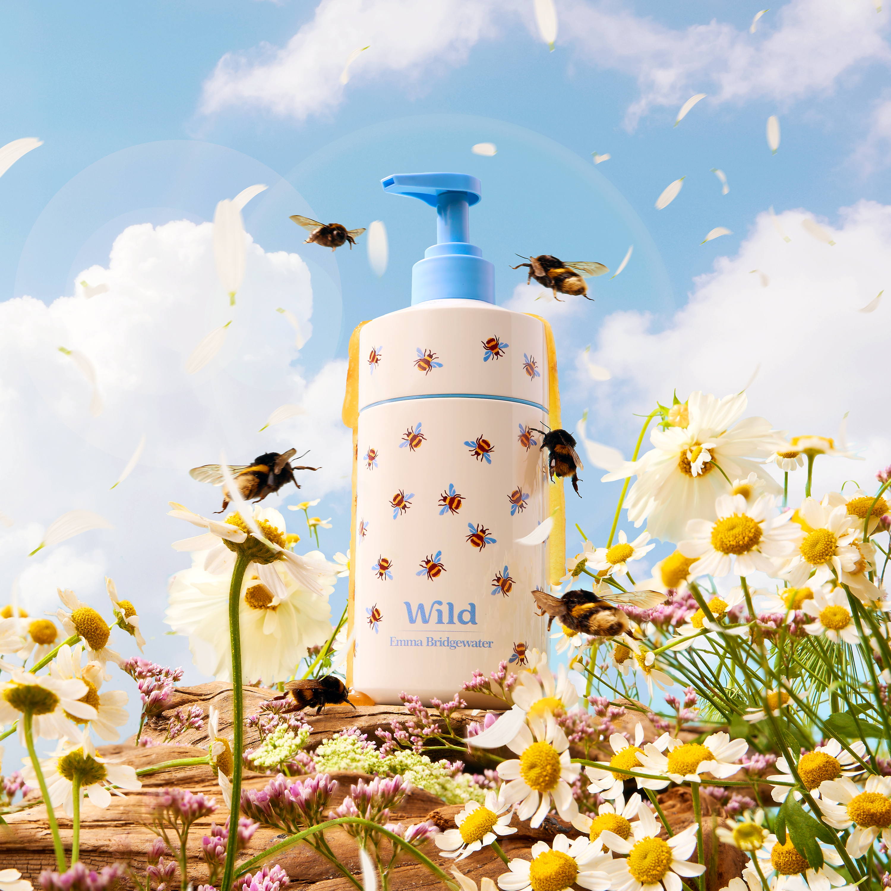 Caption: a bottle with a blue lid sitting on top of a field of flowers