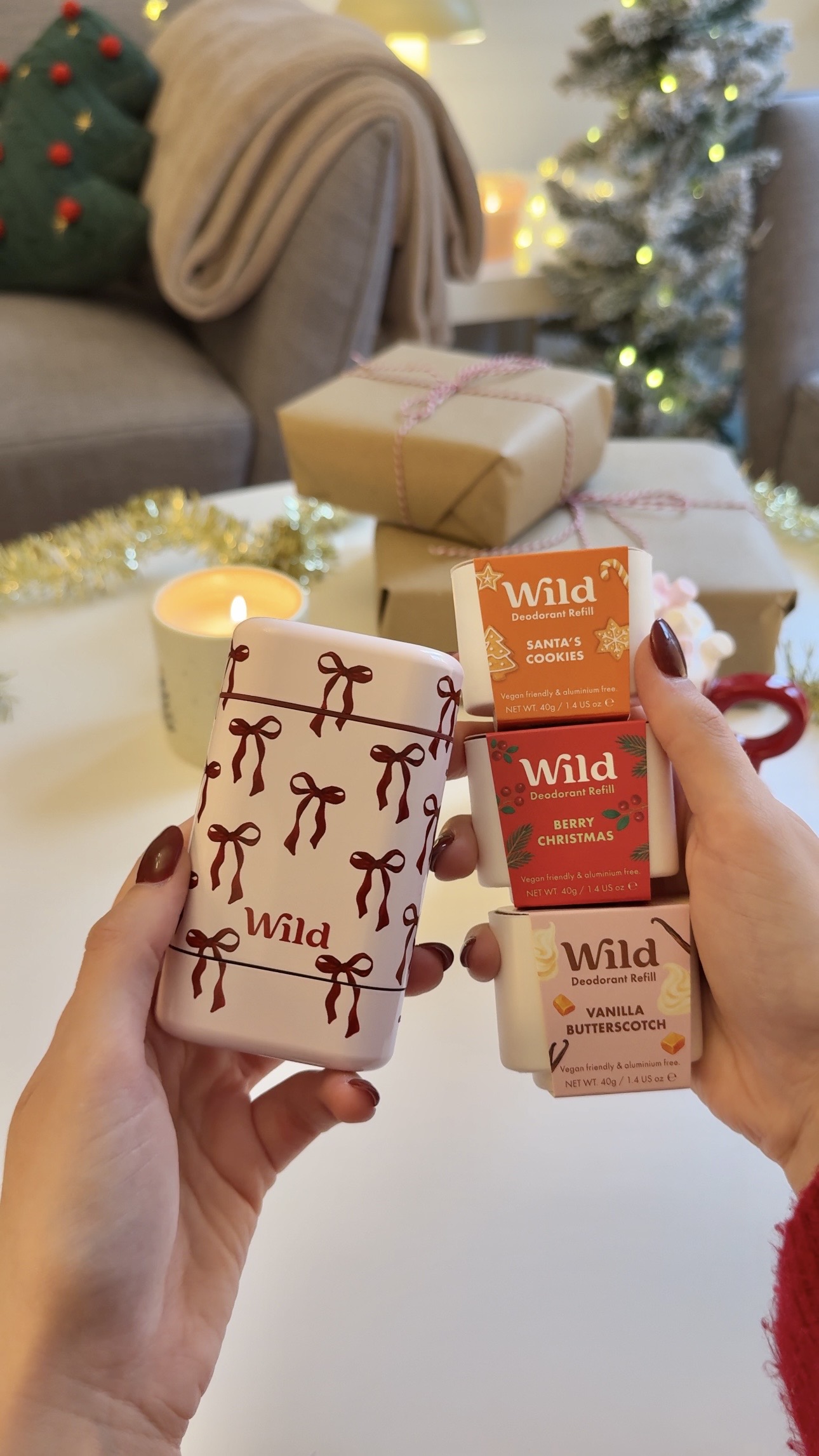 Caption: a woman holding a couple of boxes of soap
