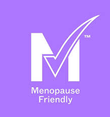 Caption: the menopause friendly logo on a purple background