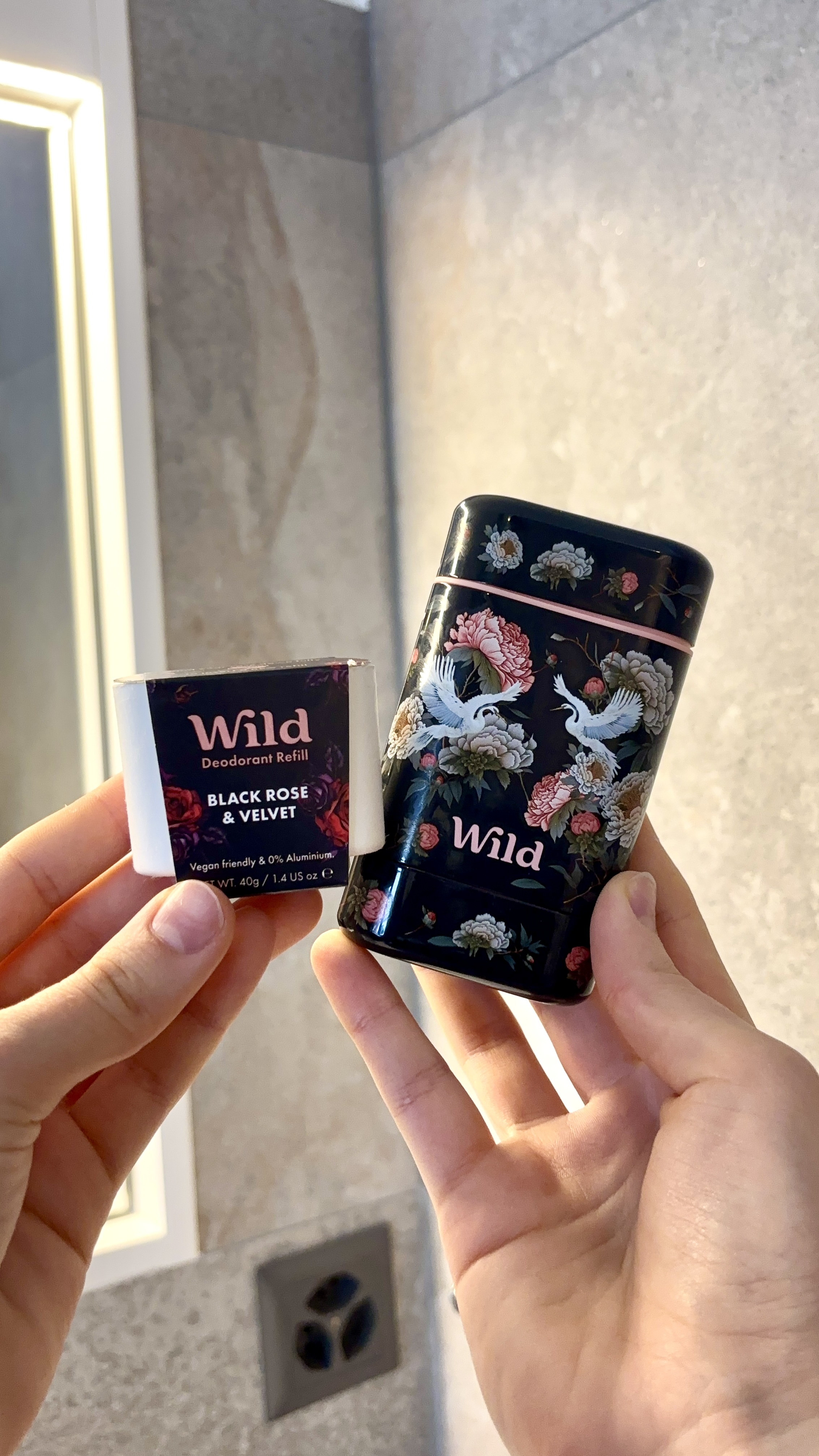 Caption: a person holding a black and white lighter in their hand