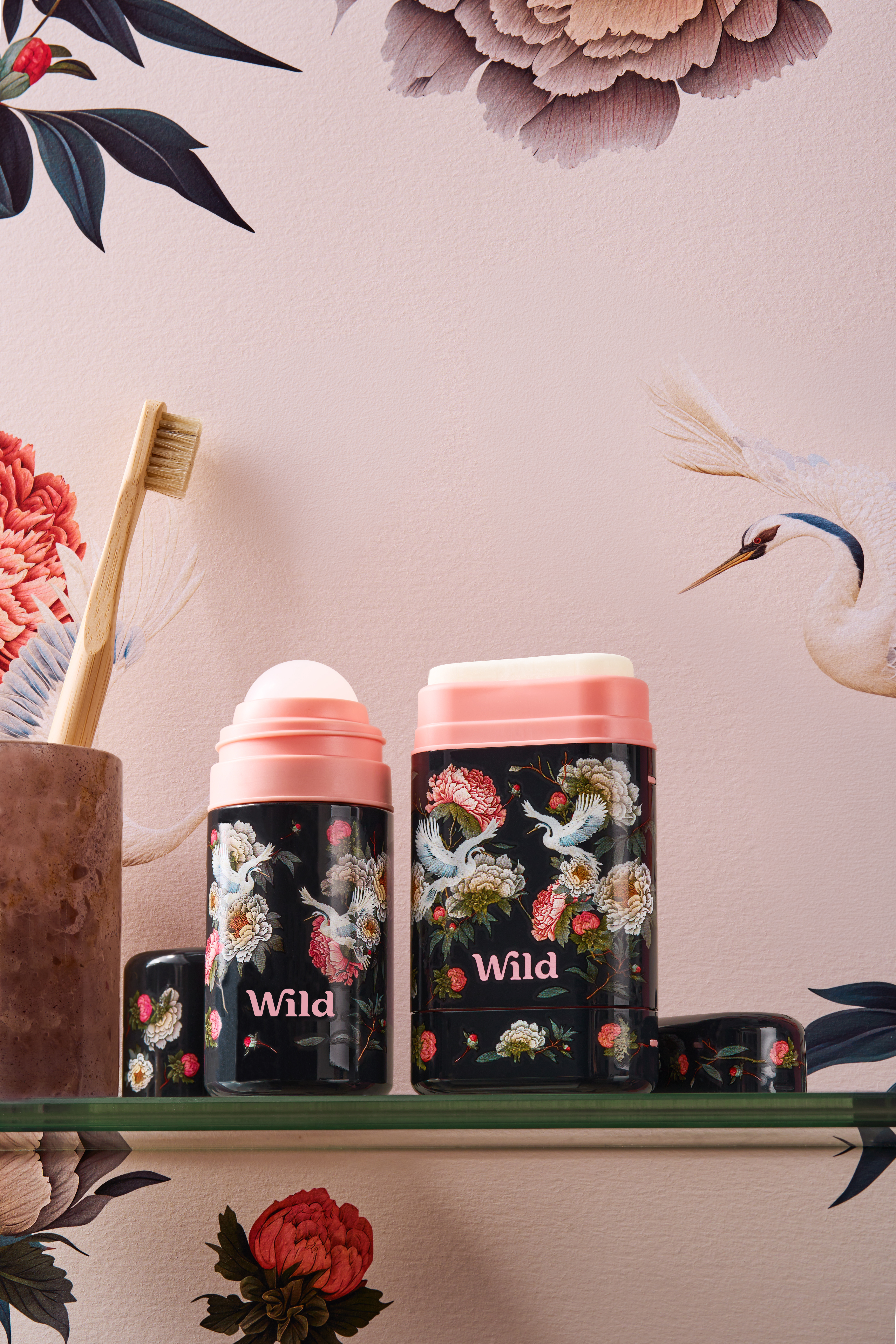 Caption: a couple of cups sitting on top of a shelf