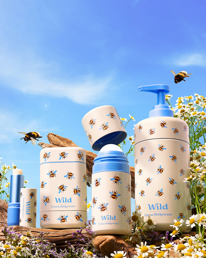 Caption: a field of wildflowers with a blue and white vase