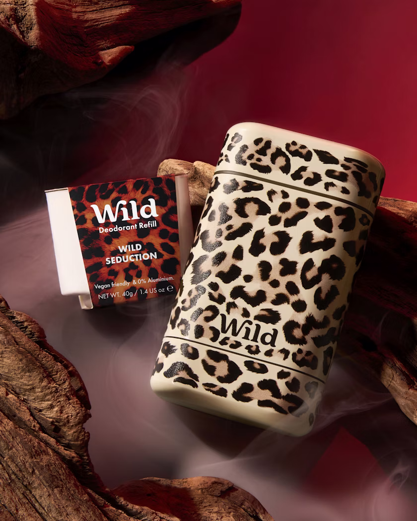 Caption: a lighter sitting on top of a wooden log