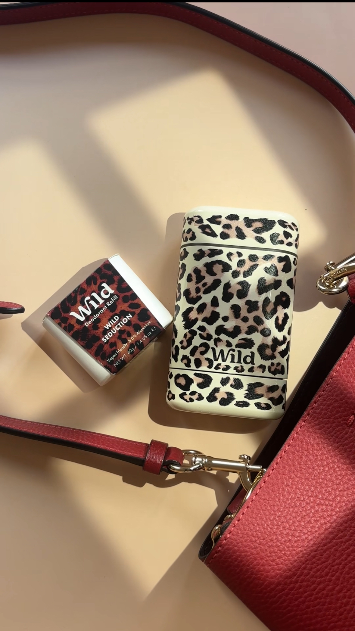 Caption: a cell phone and a wallet sitting on a table