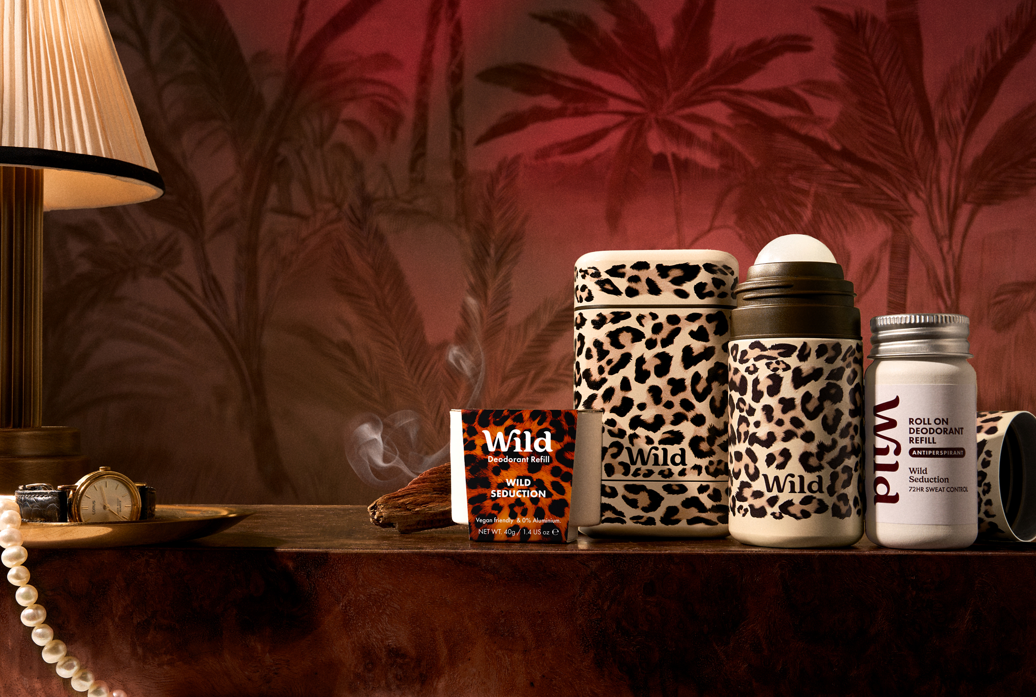 Caption: a table topped with jars and a lamp next to a lamp shade