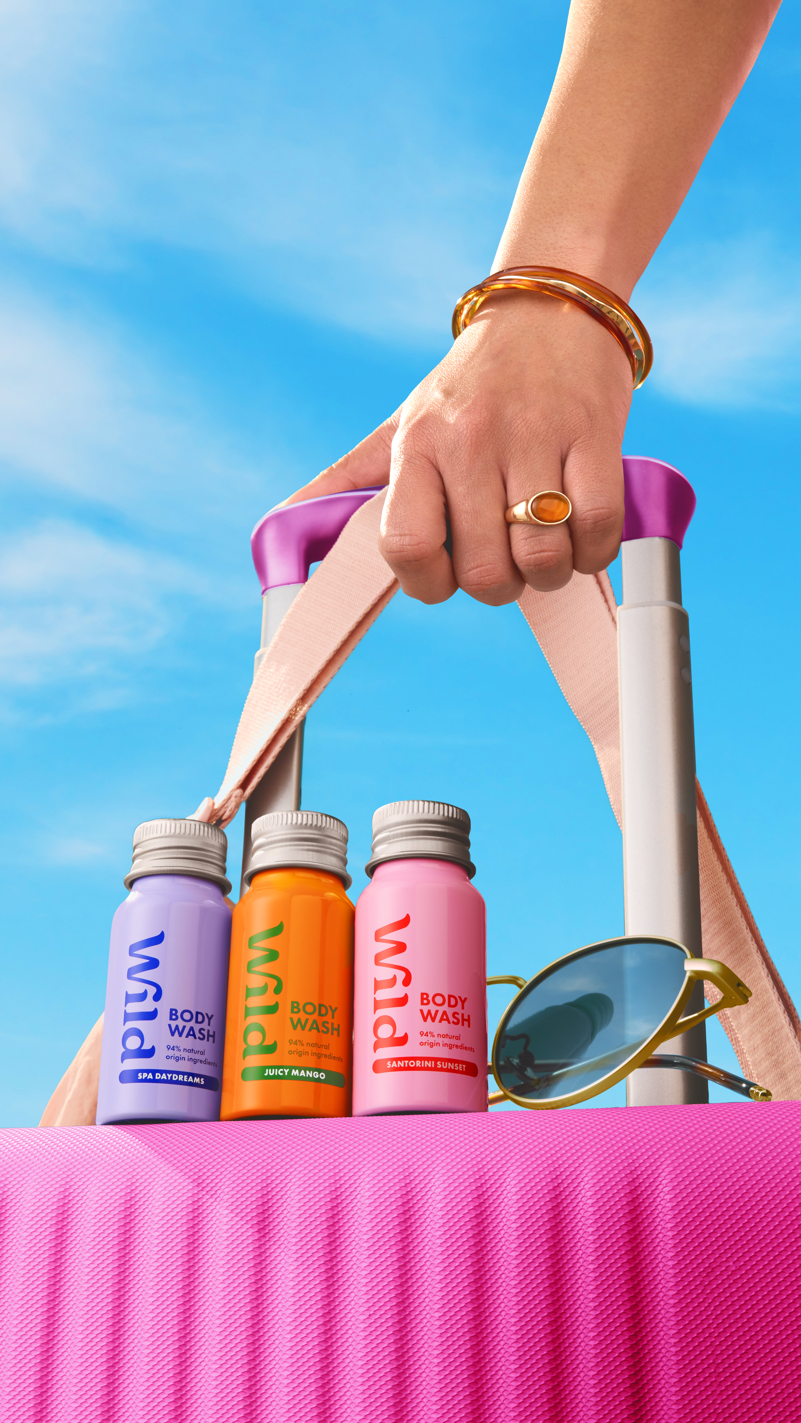 Caption: a person holding a pair of scissors and a pair of sunglasses